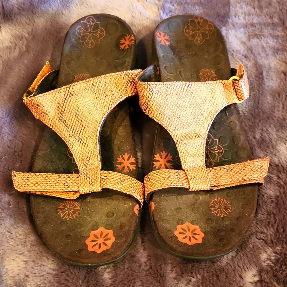 Brown and orange sandals.